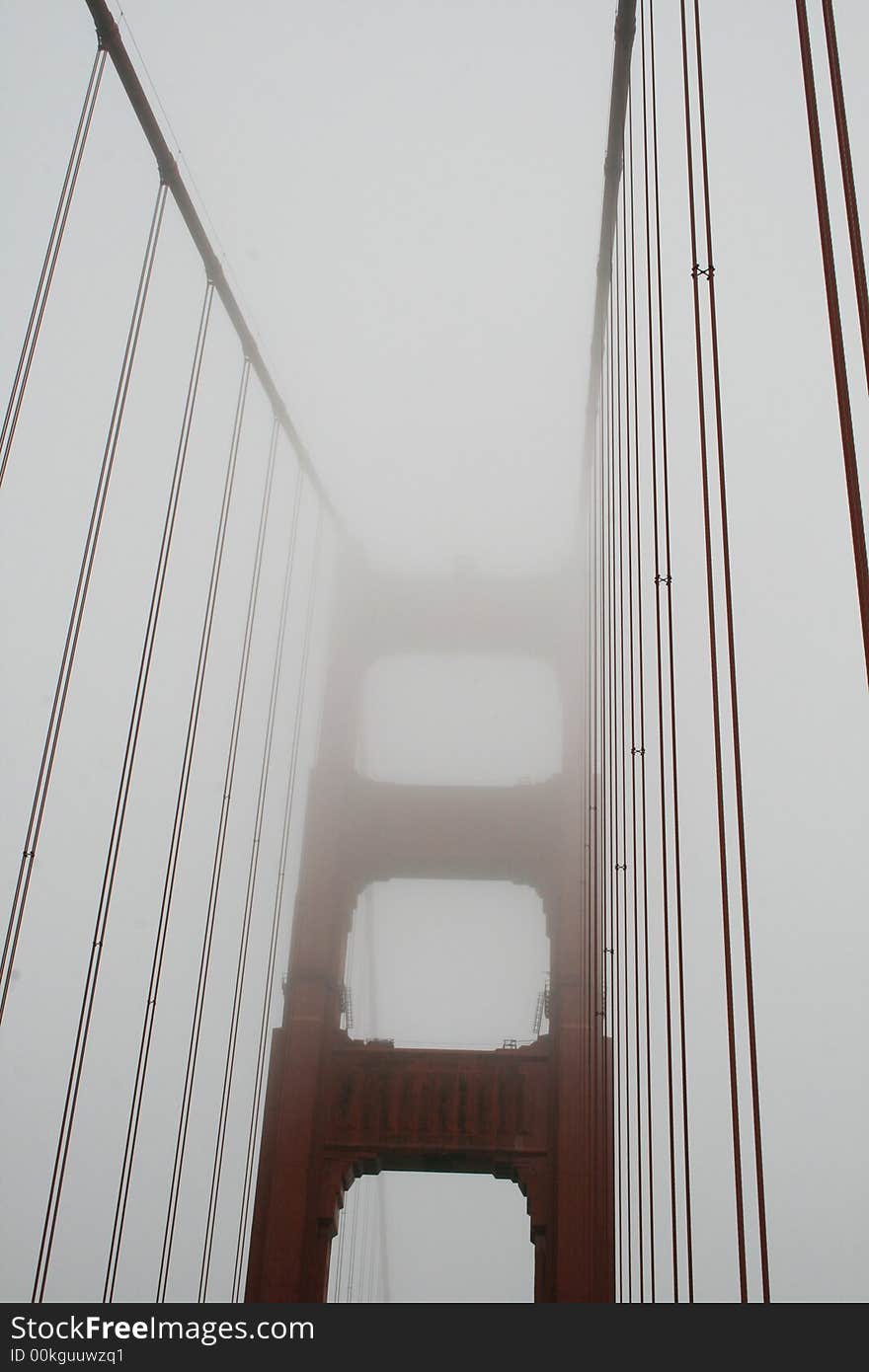 The Golden Gate Bridge encased in fog. The Golden Gate Bridge encased in fog