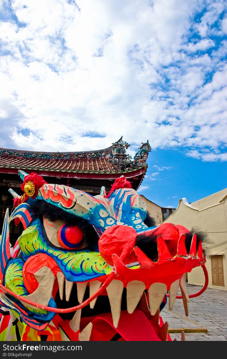 A puppet oriental dragon head with clear blue skies