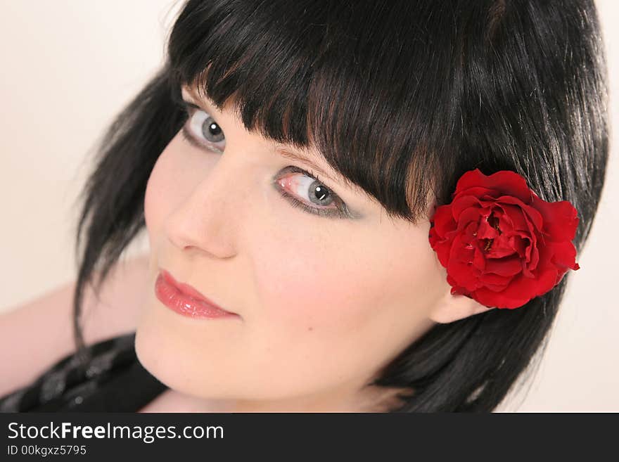 Beautiful girl with black hair and red rose. Beautiful girl with black hair and red rose