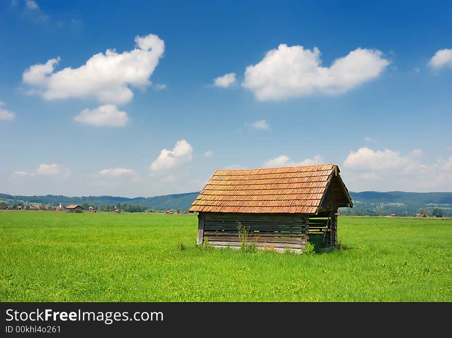 Bavarian hut horizontal on green meadow