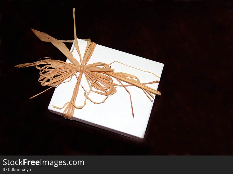 White Gift Box tied with a Straw Bow. White Gift Box tied with a Straw Bow