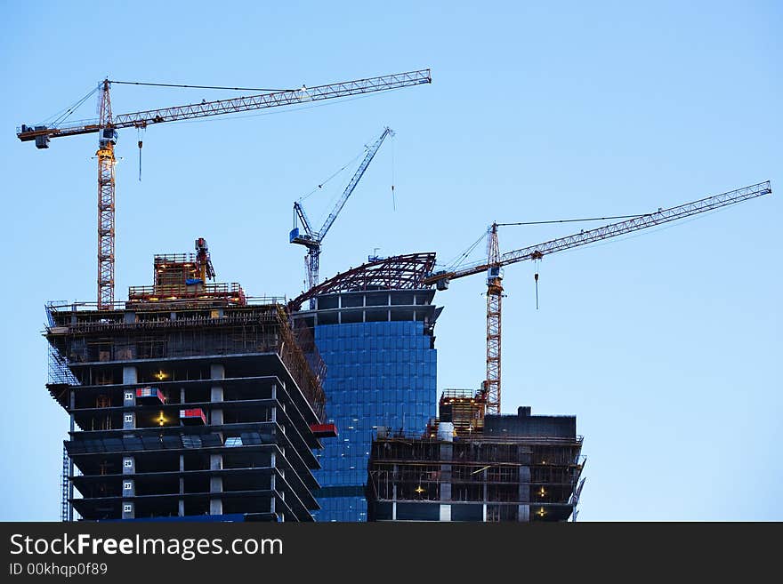 Construction of a skyscraper in Moscow, early morning. Construction of a skyscraper in Moscow, early morning