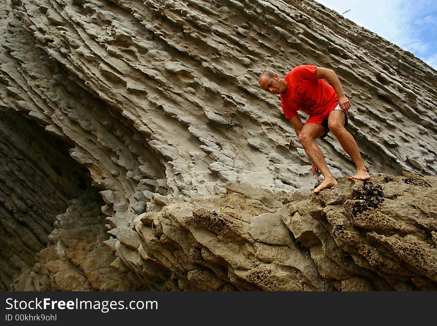 Man Jumping From Rocks