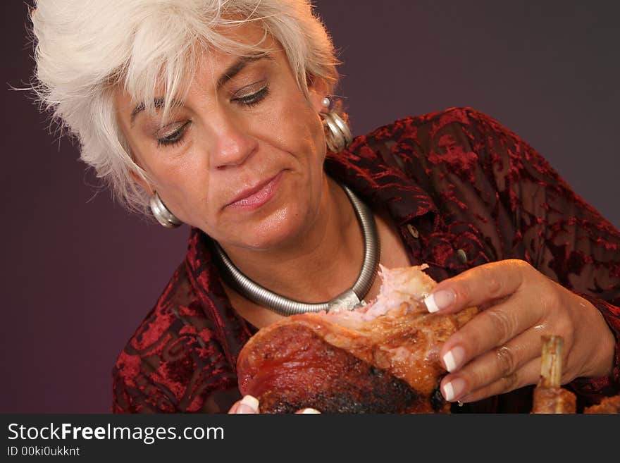 Woman looking on a big part of meat. Woman looking on a big part of meat