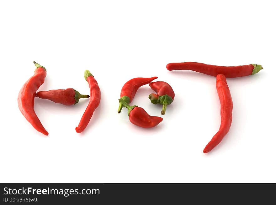 Chili peppers forming the word hot isolated on white. Chili peppers forming the word hot isolated on white