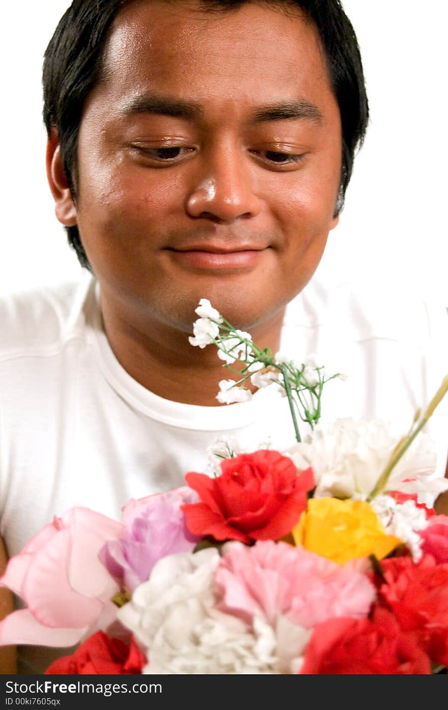 Man holds bunch of flowers