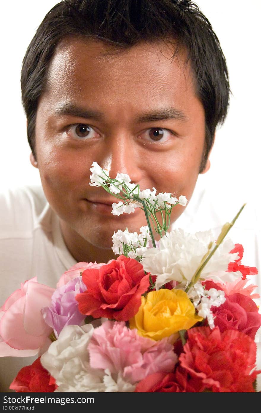 Handsome man holds flowers