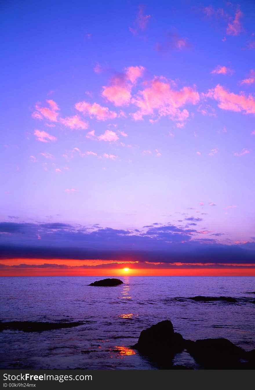 The coming sun on a background of the sea. The coming sun on a background of the sea