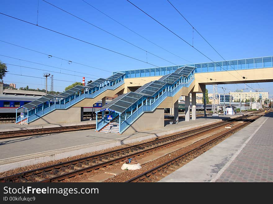 Blue railway platforms in morning hours