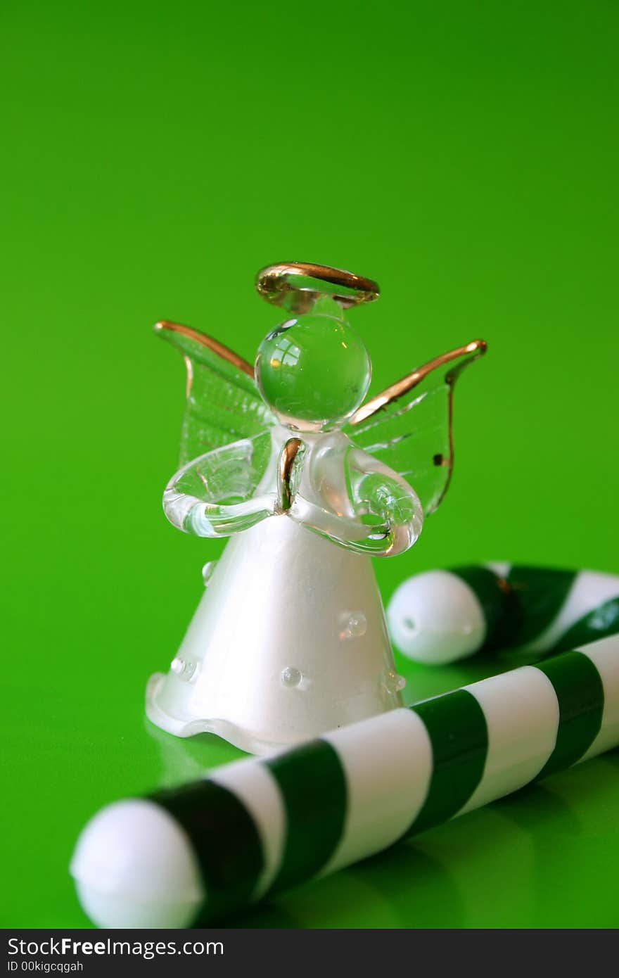 Glass Angel and Green and white candy stick. Glass Angel and Green and white candy stick