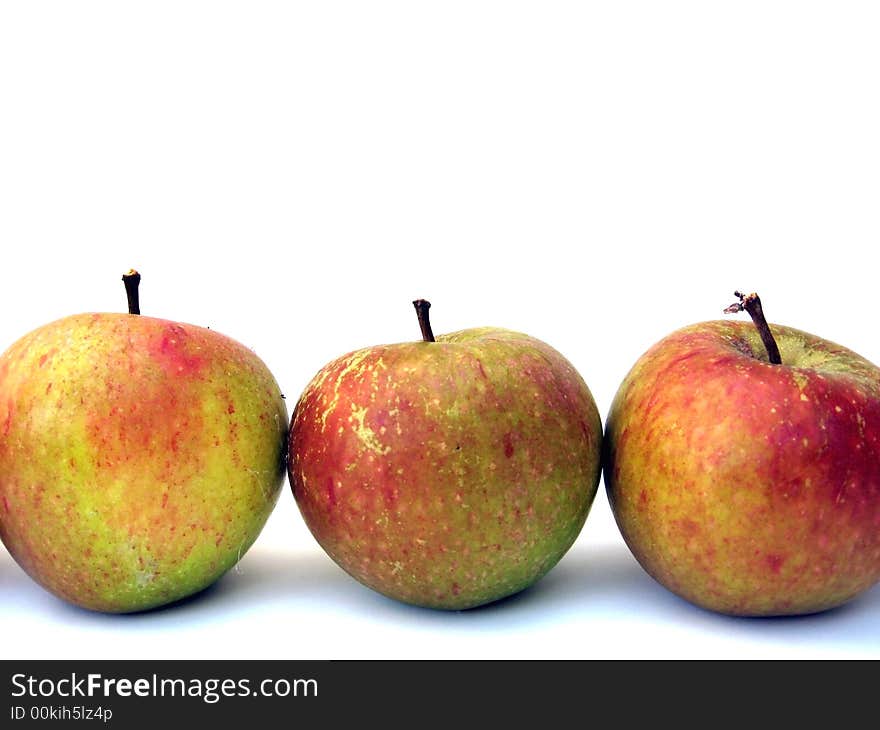 Three apples on a white background