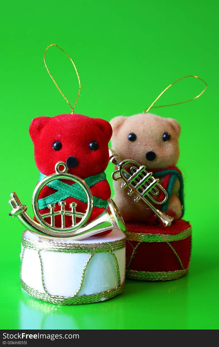 Two Christmas Bear decorations on a green background. Two Christmas Bear decorations on a green background