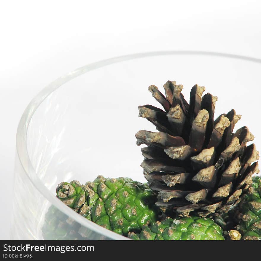 Pine cones in glass bowl