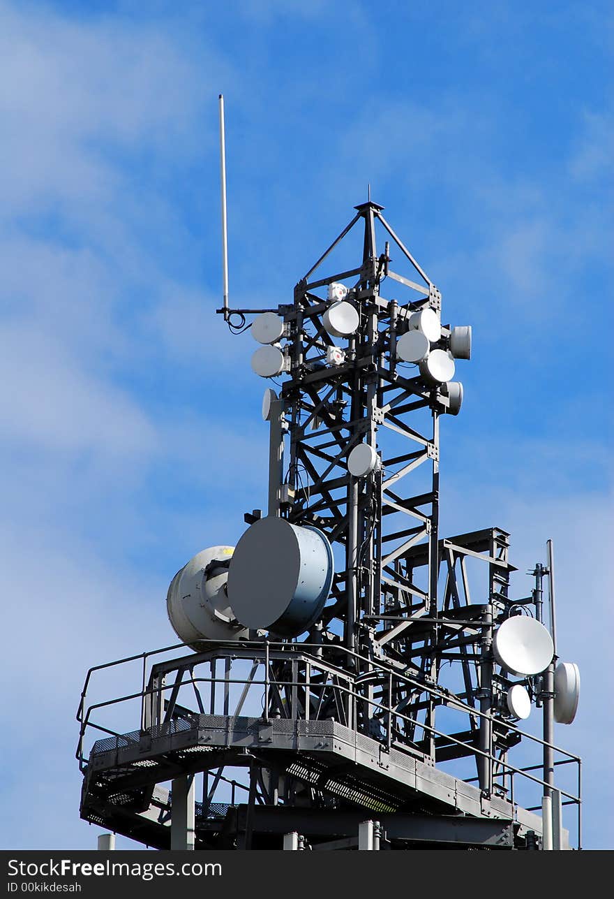 Communication mast showing range of antennas and dishes. Communication mast showing range of antennas and dishes.