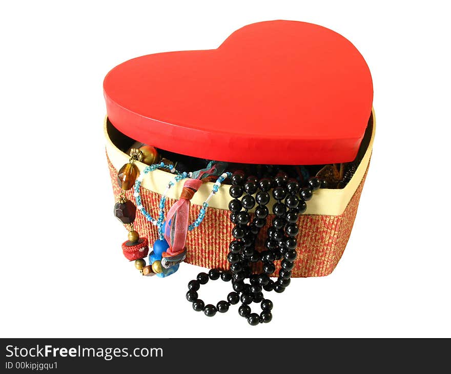 Heart shaped box with jewels and bijouterie, isolated on a white background. Heart shaped box with jewels and bijouterie, isolated on a white background