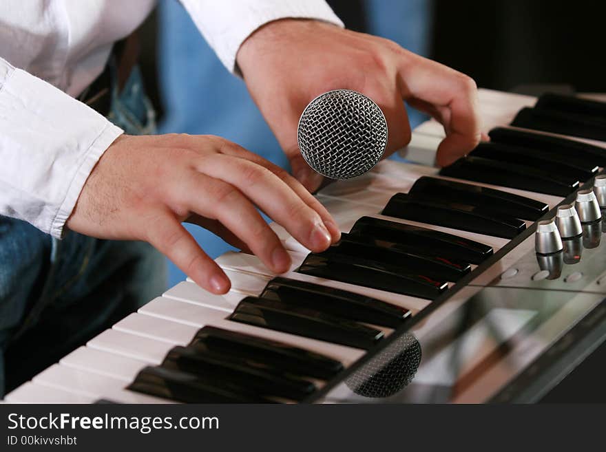 Close-up photo of hands of piano player