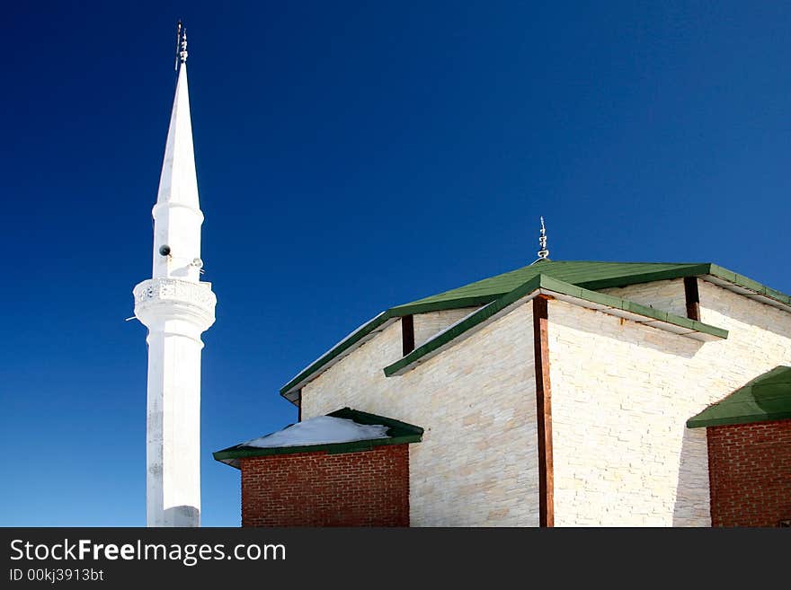 Mosque and white minaret