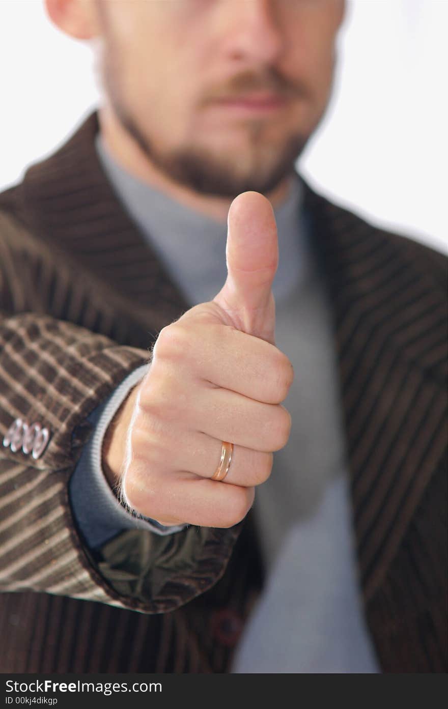 A man showing his thumb. A man showing his thumb