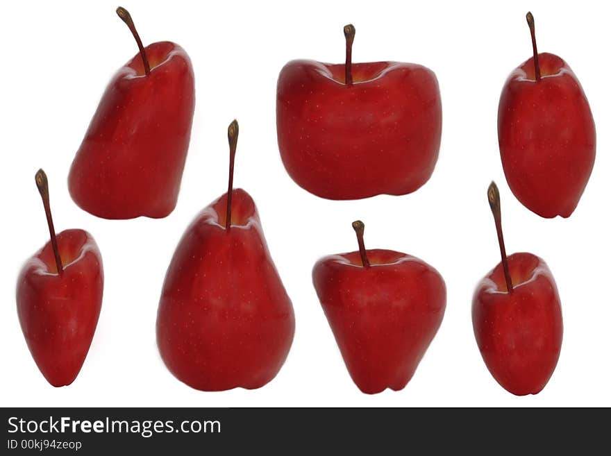 Seven red warped apples on a white background. isolated. Seven red warped apples on a white background. isolated