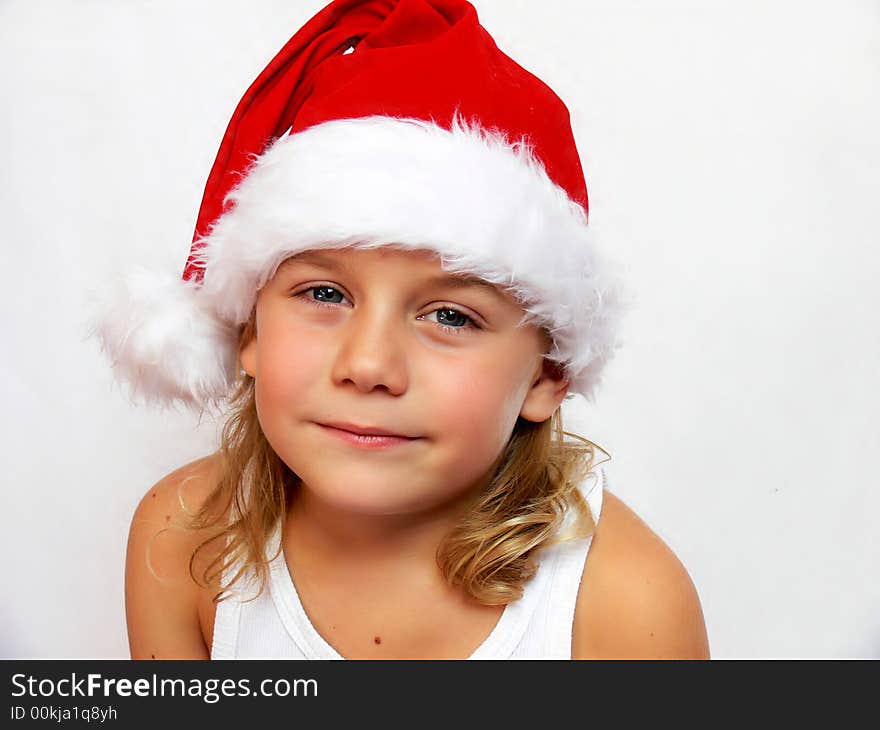 Child with santa hat on a white background