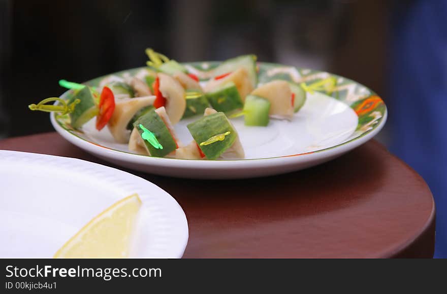 Assorted snack with cucumbers and mushrooms on a plate. Assorted snack with cucumbers and mushrooms on a plate