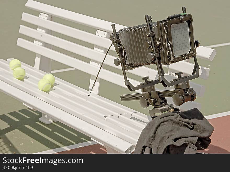 A 4x5 camera is setup to photograph some tennis balls.