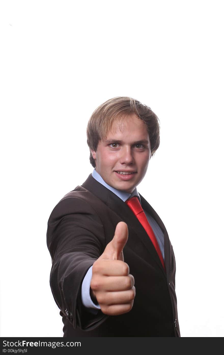 Young business man showing thumb up isolated