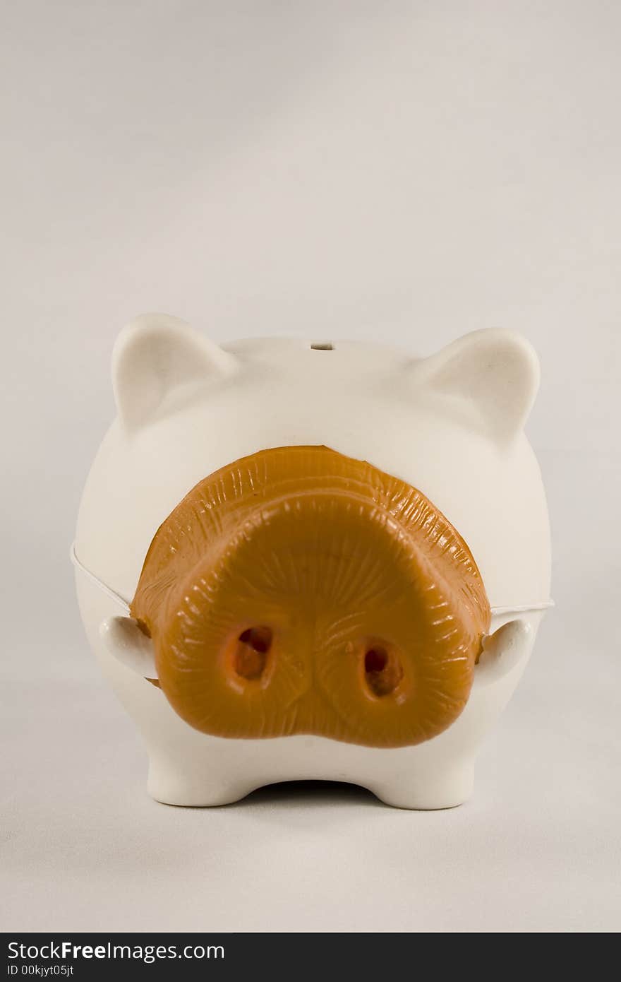 White piggy bank wearing a boar's nose. White piggy bank wearing a boar's nose.