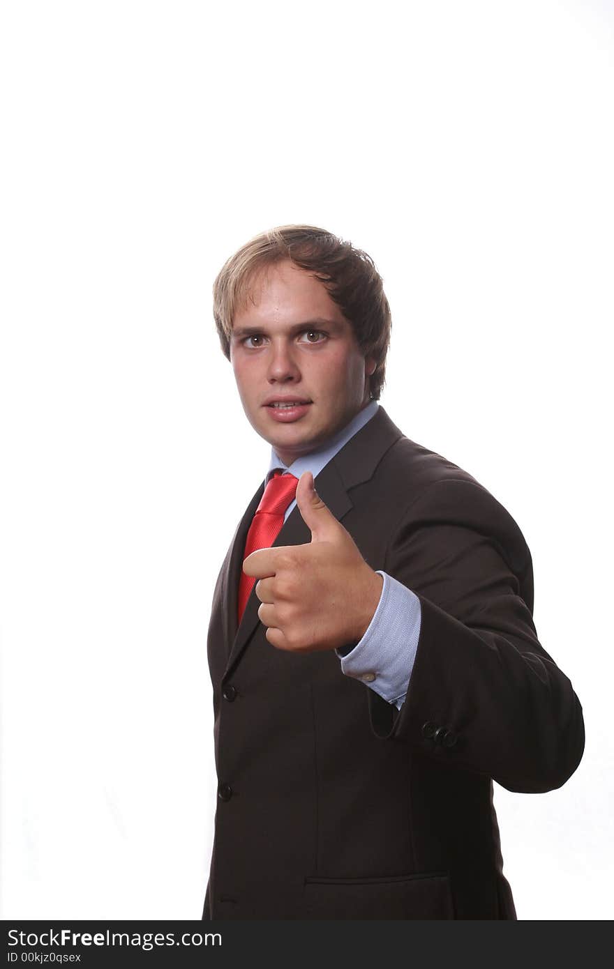 Young business man showing thumb up isolated