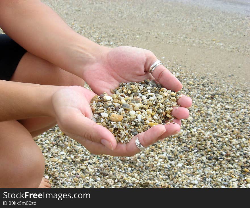 Hands With Pebbles