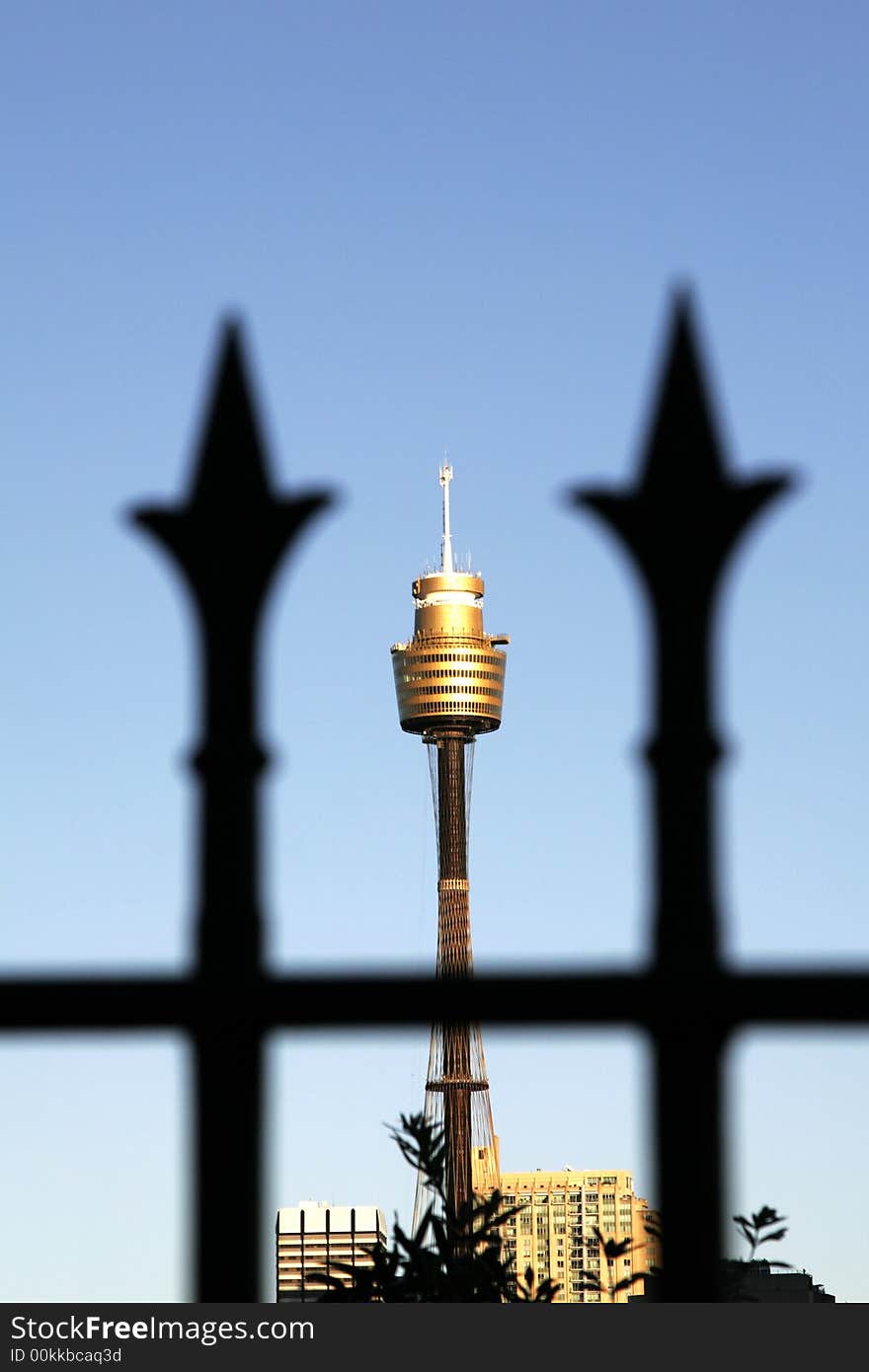 Sydney Tower Between Two Fence Spikes, Focus On Tower, Tallest Building In The Southern Hemisphere, Australia