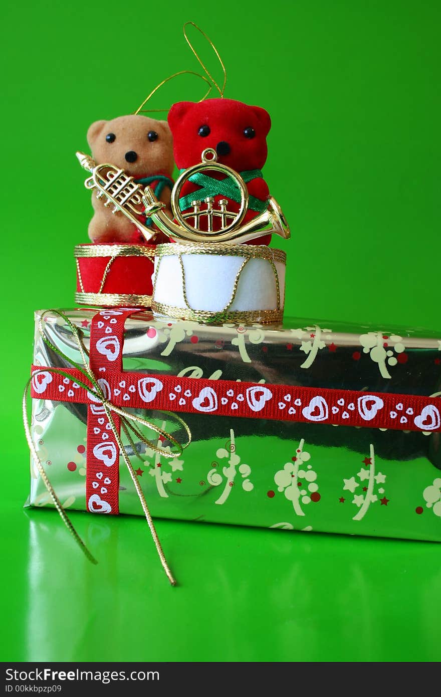 Christmas decoration Teddy Bears on a gold wrapped gift. Christmas decoration Teddy Bears on a gold wrapped gift