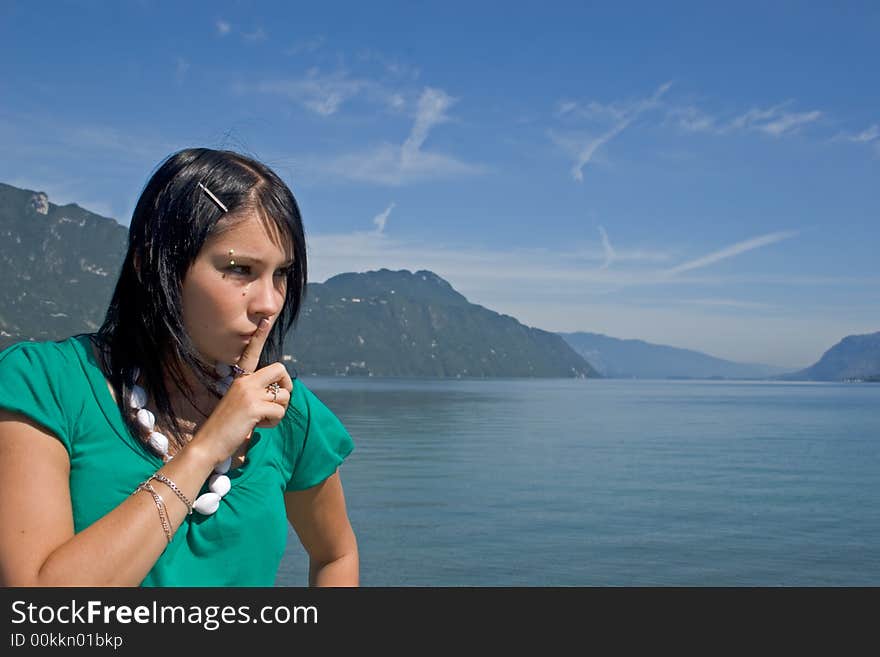 Portrait of a young woman asking for silence