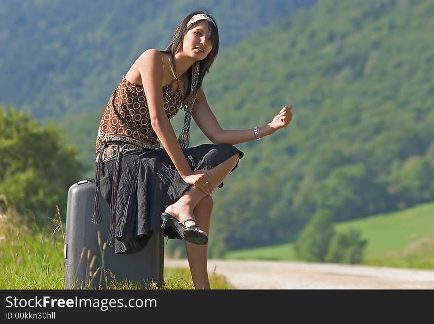 Woman making of hitch-hiking