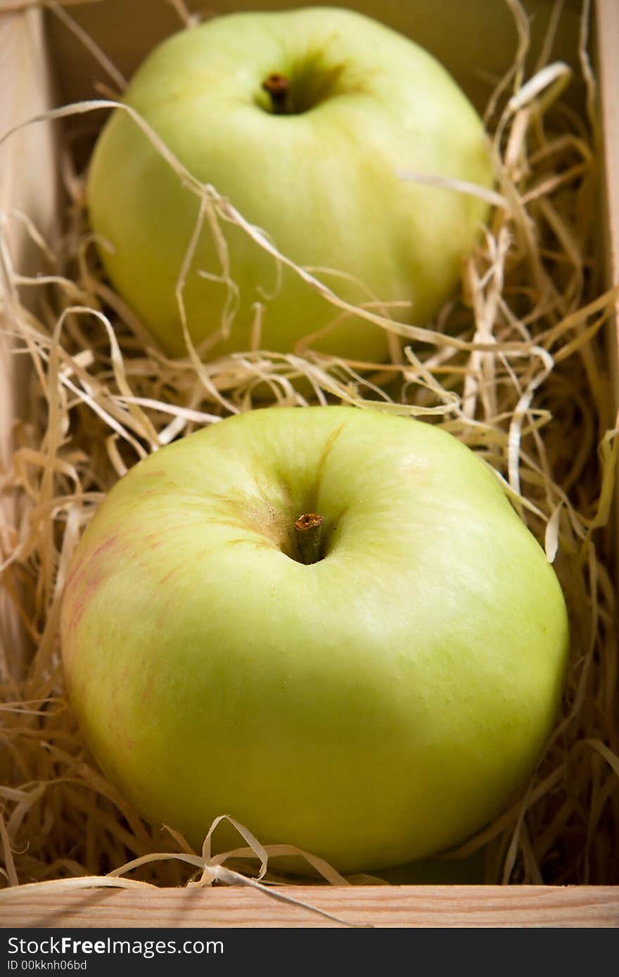 Green apples in the  wooden box. Green apples in the  wooden box