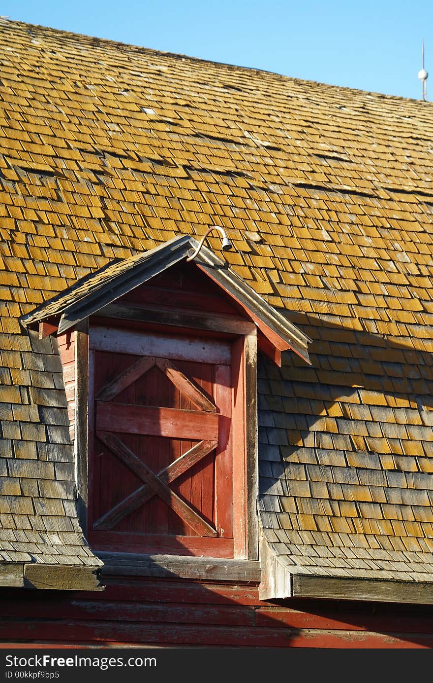 Barn gable on roof during sunset. Barn gable on roof during sunset