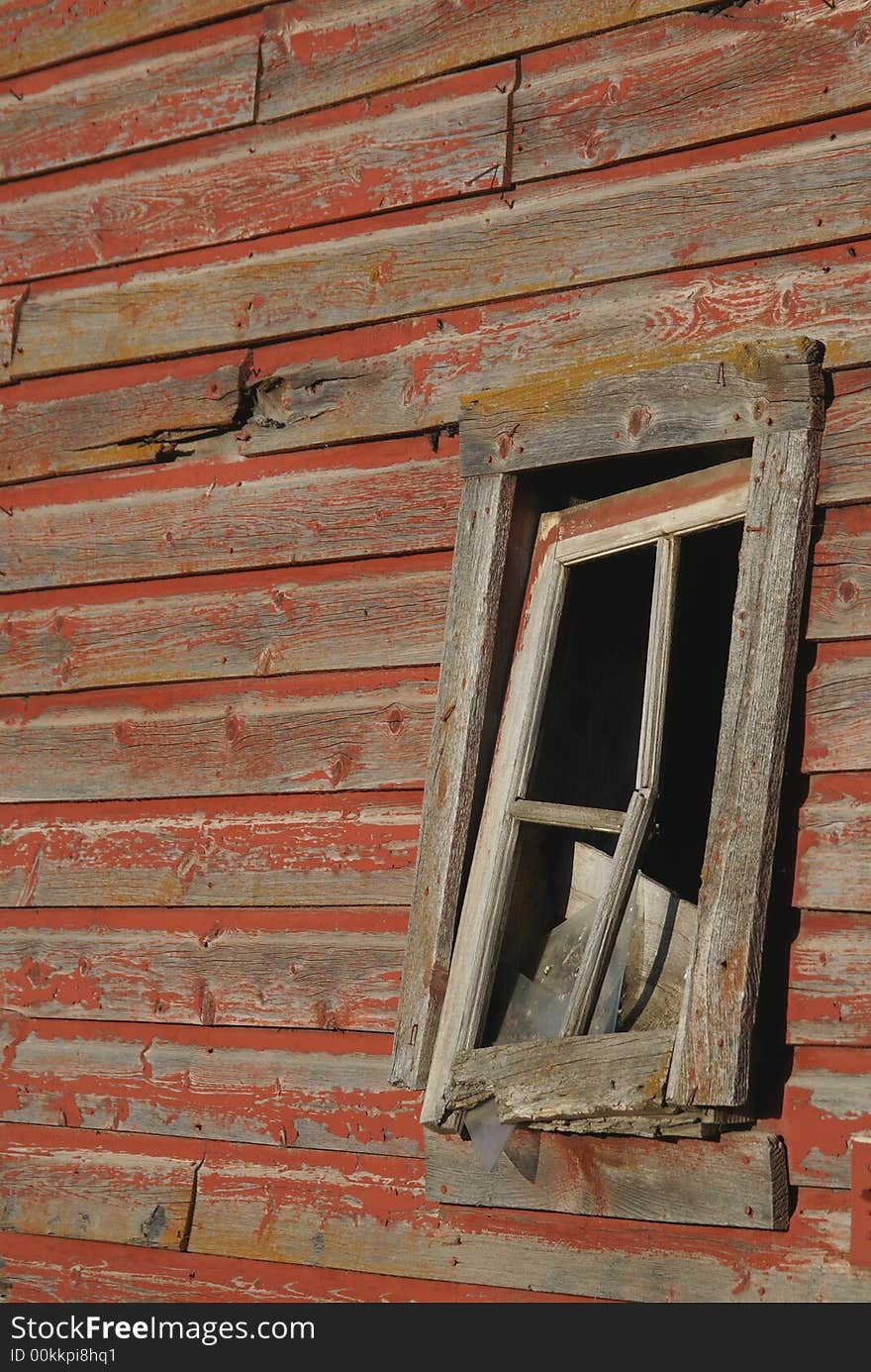 Broken Barn Window on Old Wall