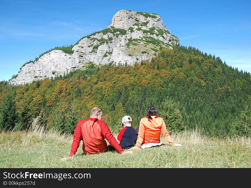 Young family relaxing in the beautiful nature. Young family relaxing in the beautiful nature