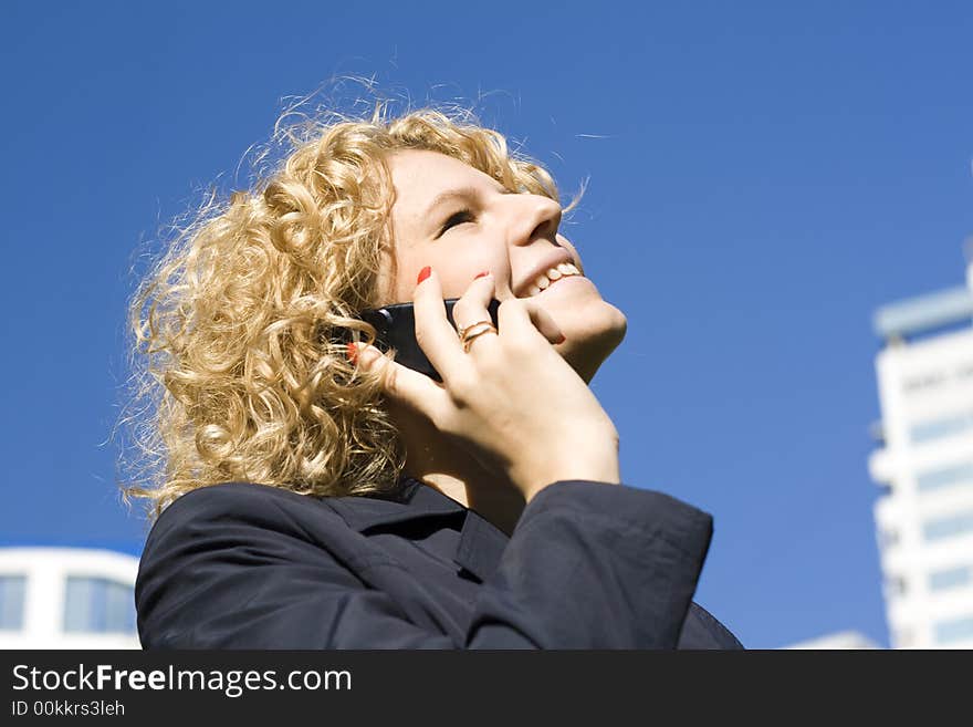 Business woman talks by phone