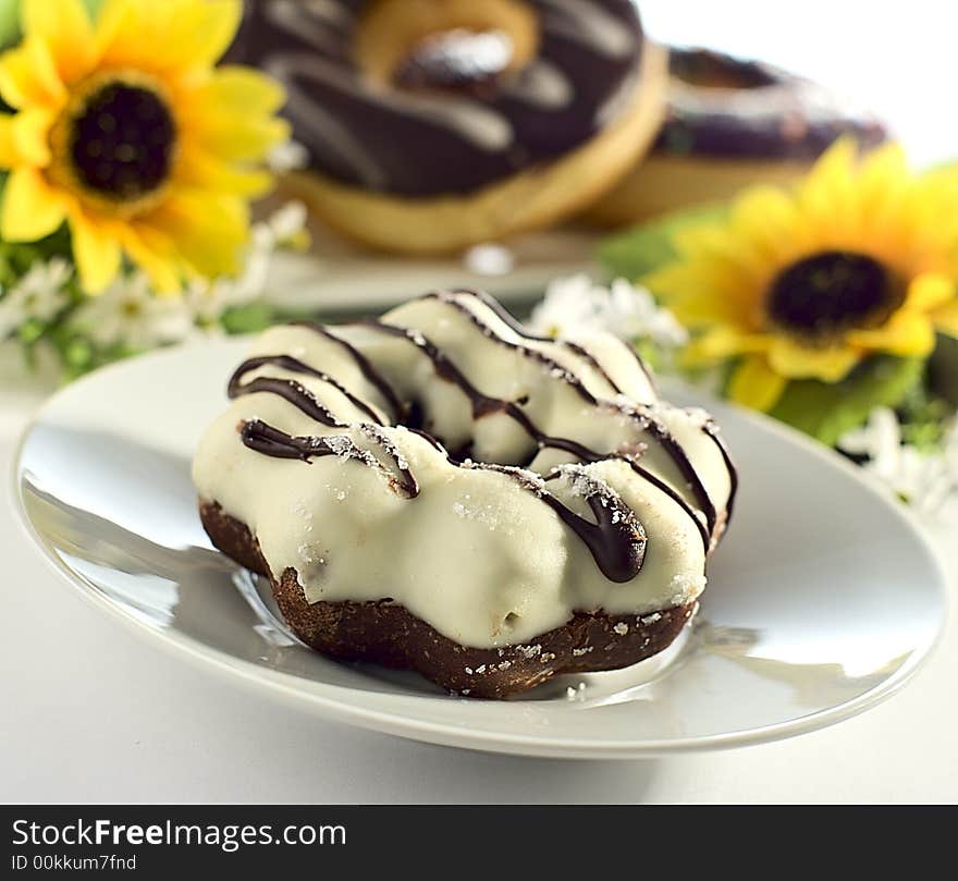 White chocolate donut on a saucer. White chocolate donut on a saucer