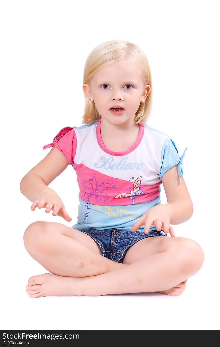 Cute fair-haired girl siting on the floor. Cute fair-haired girl siting on the floor