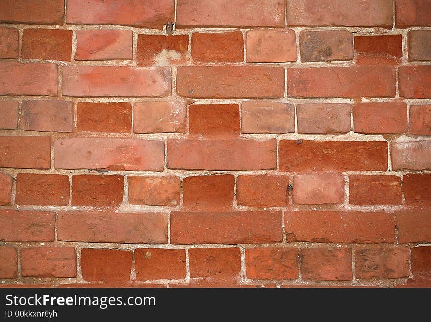 The old cracked wall from a red brick. The old cracked wall from a red brick