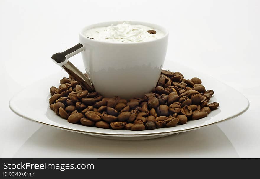 Cup of coffee with beans