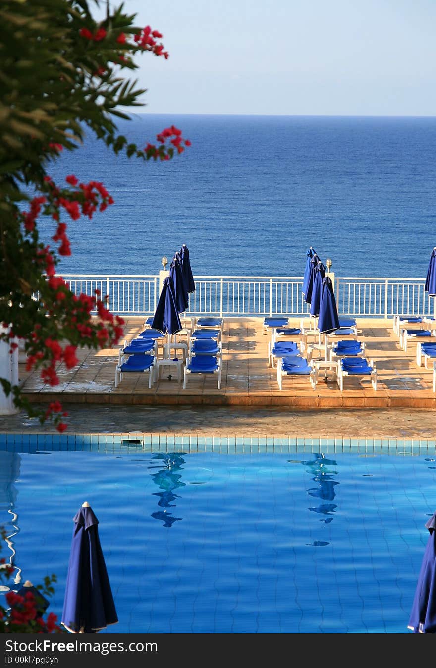 View of swimming pool and ocean at a tourist resort