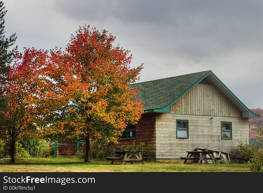 A wooden house in Quebec in Fall. A wooden house in Quebec in Fall.