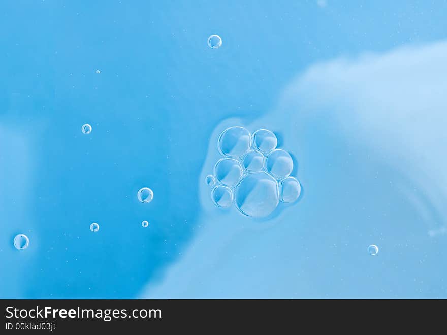 Abstract blue background with air bubbles on water surface