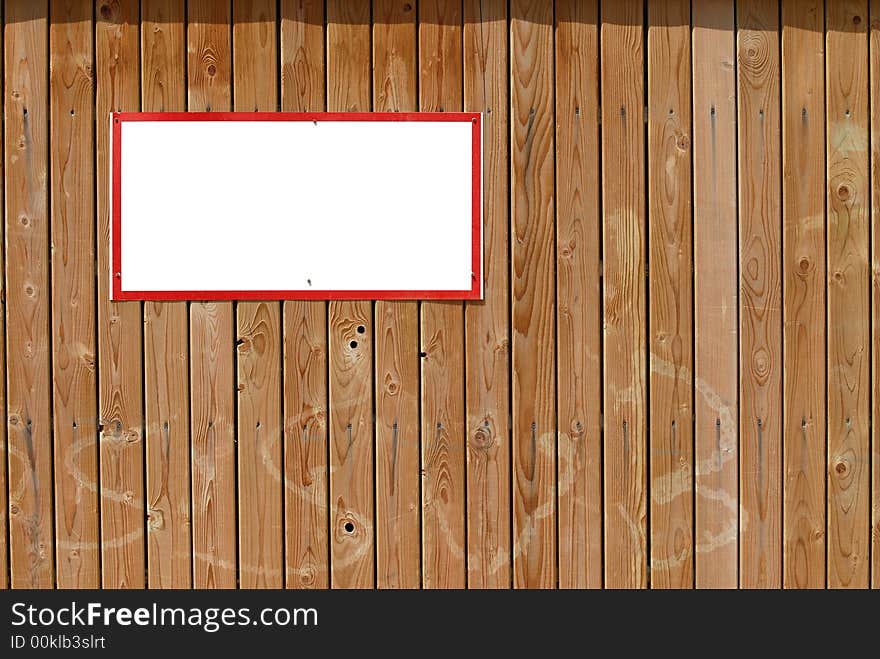 Blank warning sign with red frame on wooden wall. Blank warning sign with red frame on wooden wall