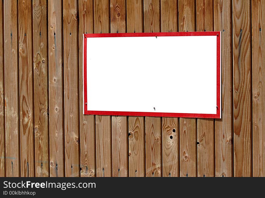 Blank warning sign with red frame on wooden wall. Blank warning sign with red frame on wooden wall