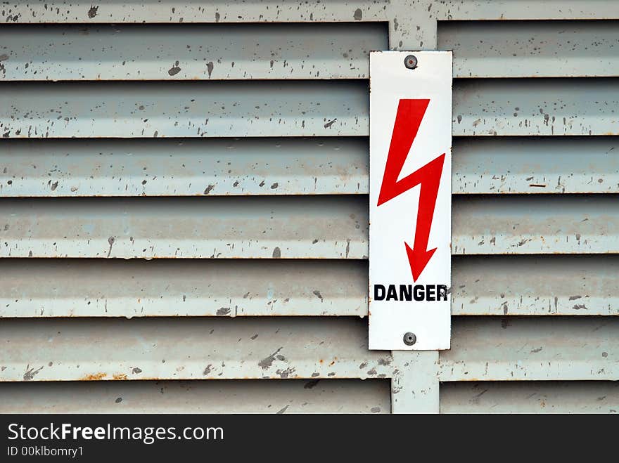 Electricity danger lightning sign on old metal surface. Electricity danger lightning sign on old metal surface