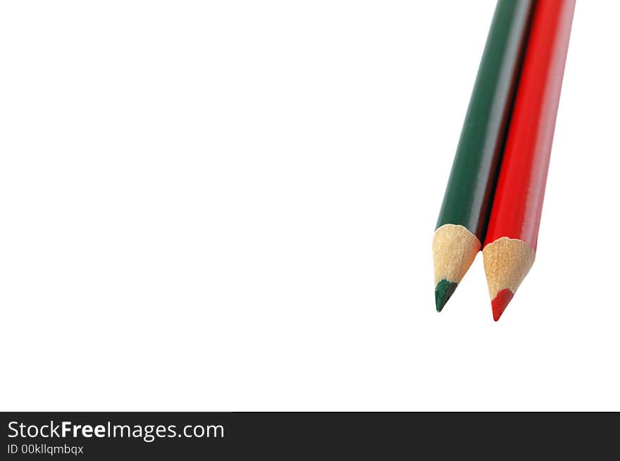 Red and green colored pencils isolated on white background. Red and green colored pencils isolated on white background.